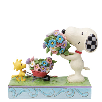 Snoopy und Woodstock pflücken Blumen